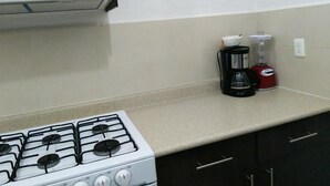 Family Apartment, 3 Bedrooms, Non Smoking, Kitchen | Private kitchen | Fridge, microwave, stovetop, cookware/dishes/utensils - Apartamento Vacacional (Playa del Carmen)