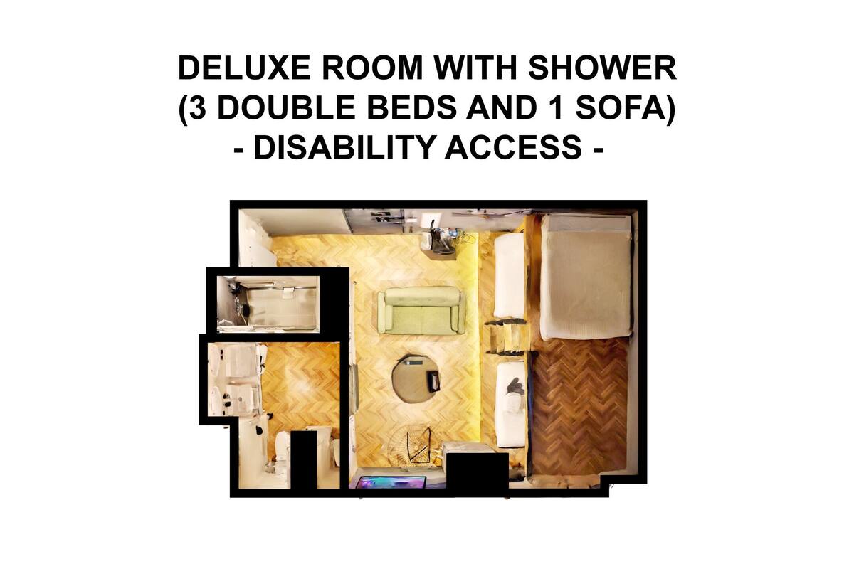 A deluxe room with a shower, 3 double beds, and 1 sofa, featuring disability access.