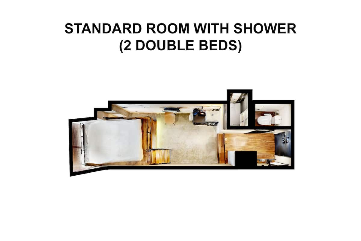 A standard room with two double beds, a shower, and a small kitchenette.