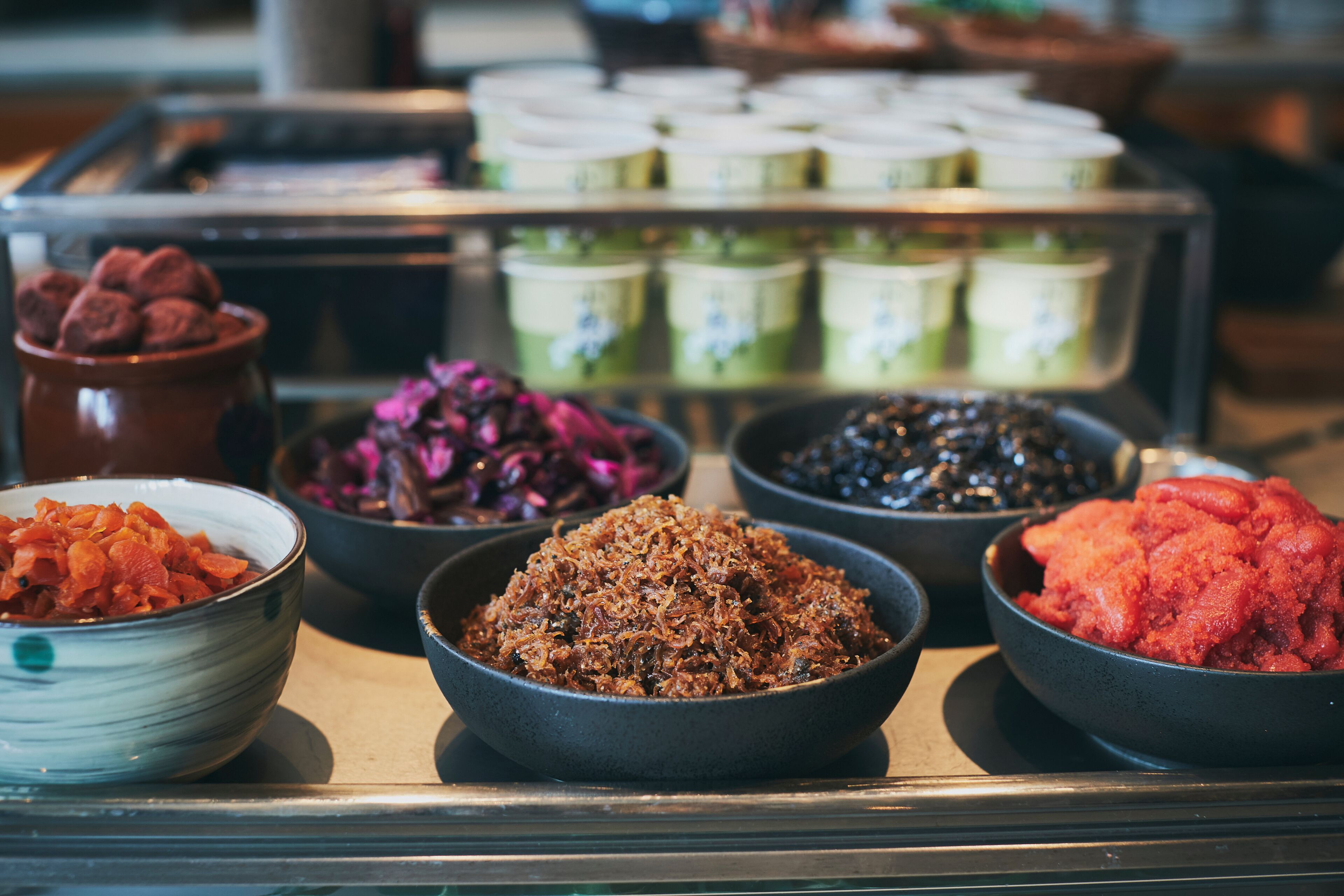 A display of various food items in bowls.