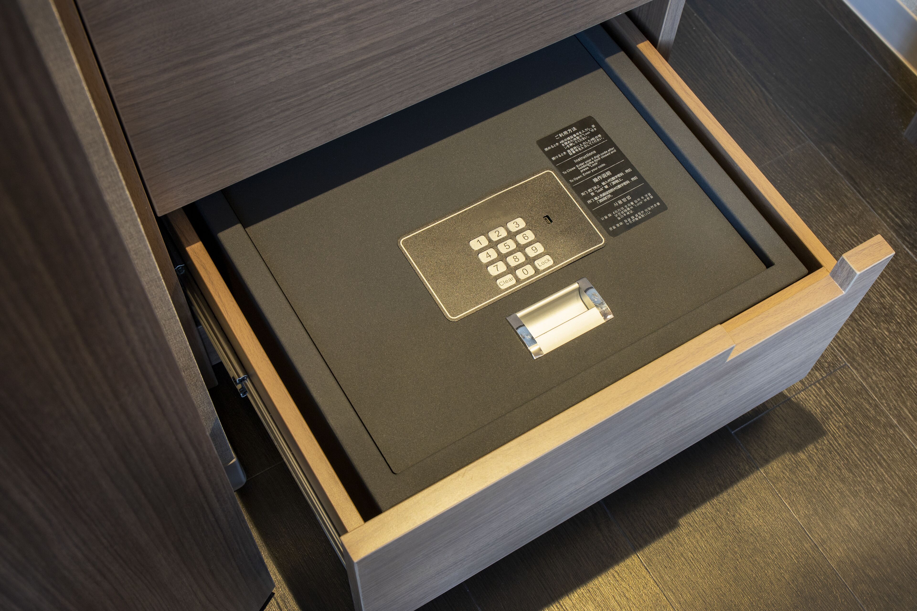 A drawer with a built-in lock and a card reader, likely for secure storage.