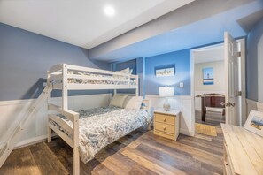 You'll love the coastal-blue bedroom with bunk beds perfect for kids or friends. Bright, inviting, and steps from your own bathroom—comfort and privacy combined.
