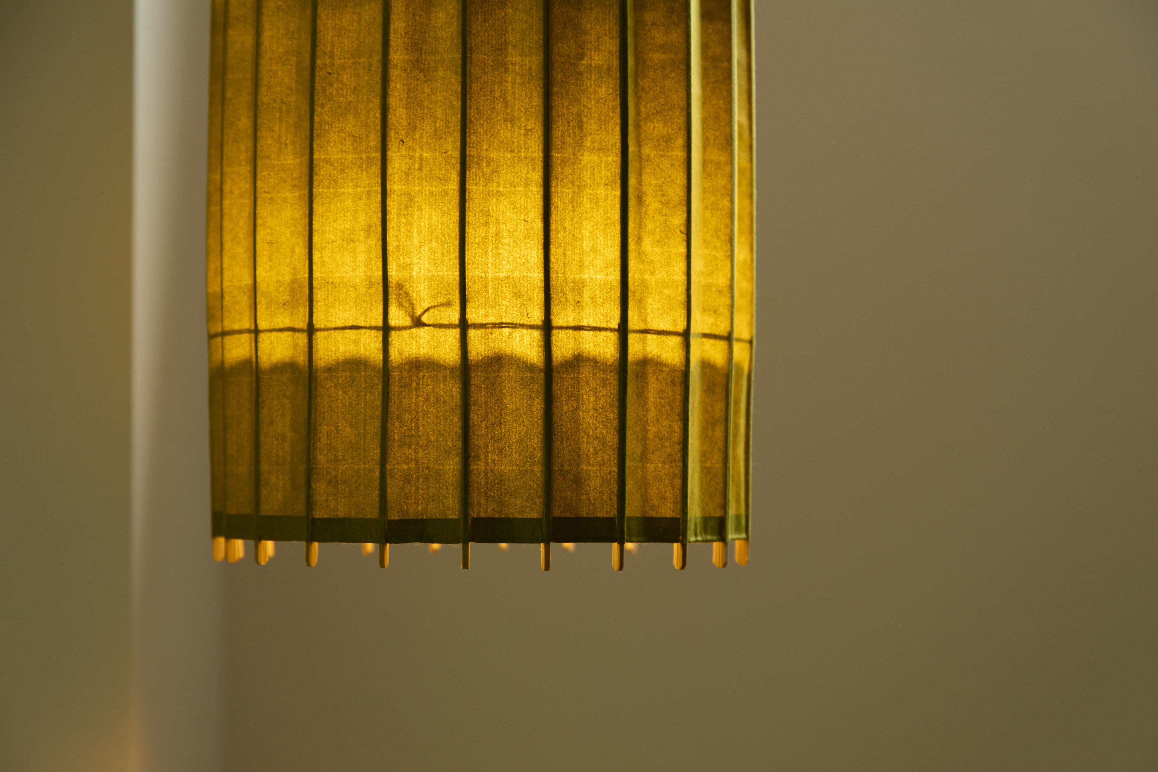 A close-up of a window with vertical blinds.