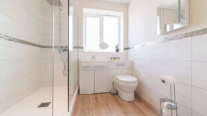 Shower, hair dryer, towels, shampoo