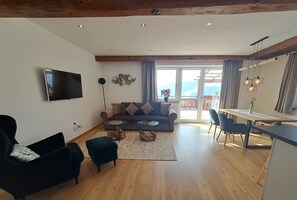 Classic Apartment, 2 Bedrooms, Terrace, Mountain View (Hohe Salve) | Living area | 49-inch flat-screen TV with satellite channels, TV, heated floors - Panorama Appartements Filzerhof (Kirchberg in Tirol)