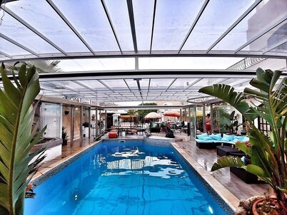 Unique winter heated / covered pool, open skies in summer, year round fun & swim