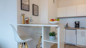 Fridge, microwave, stovetop, coffee/tea maker