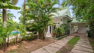 Enjoy a serene retreat amidst lush gardens and a pool.