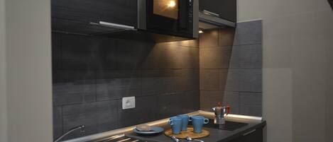 Fridge, microwave, stovetop, coffee/tea maker