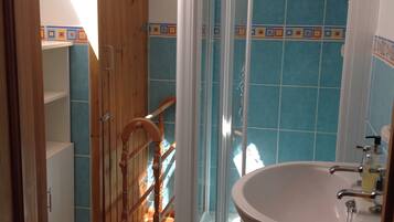 Combined shower/tub, hair dryer, towels, soap