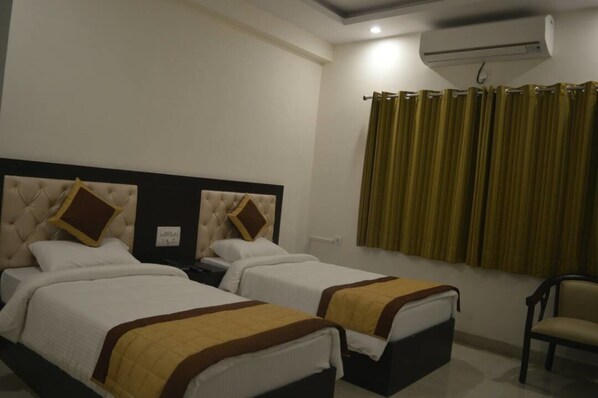 Standard Twin Room, 2 Single Beds | Blackout curtains, iron/ironing board, rollaway beds, bed sheets