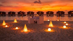 A beachside dining area with overwater bungalows and a sunset view. - You & Me Maldives - Adults Only - Premium All-Inclusive (Uthurumaafaru)