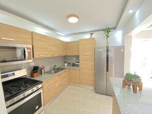 Fridge, microwave, oven, stovetop - Waterfront View apartment at Riviera Colonial   (Santo Domingo)