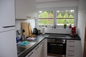 Design-Apartment, Stadtblick | Eigene Küche | Großer Kühlschrank, Ofen, Herdplatte, Geschirrspüler