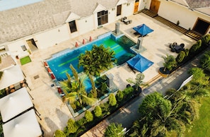 Outdoor pool, open 9:00 AM to 6:00 PM, pool umbrellas, pool loungers