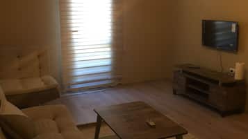 Classic Suite, 1 Bedroom | Living area | LCD TV