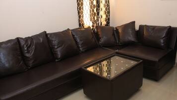 Luxury Suite, 1 Queen Bed, City View | Living area | LED TV, fireplace