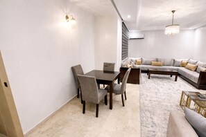 Superior Apartment, 2 Bedrooms | Living area | 42-inch LED TV with satellite channels, TV, DVD player