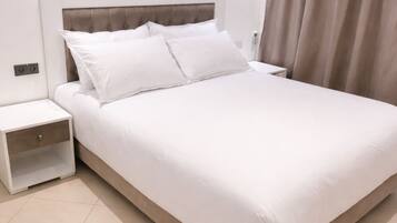 Superior Apartment, 2 Bedrooms | Premium bedding, in-room safe, individually decorated, laptop workspace
