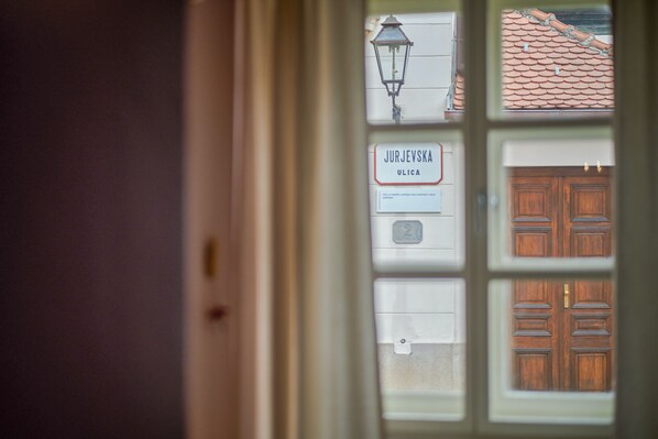A window with a sign reading "Jurjevska Ulica" and a traditional wooden door.