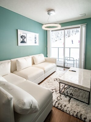 Luxury Apartment, Non Smoking, Mountain View (3) | Living area | Flat-screen TV, fireplace, heated floors - Starry (Hakuba)