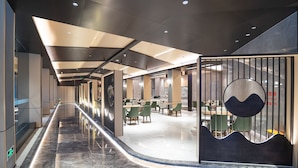 A modern hotel lobby with a long corridor, seating areas, and a reception desk. - Country Inn & Suites by Radisson  (Shanghai)