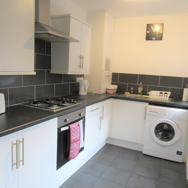 House, Multiple Beds | Private kitchen | Full-size fridge, microwave, oven, stovetop