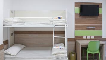 A bunk bed with a desk and chair, a television, and a trash can.