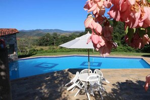 Outdoor pool, open 8:00 AM to 9:00 PM, pool umbrellas