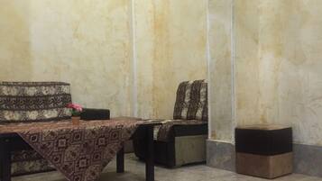 Suite Confort, 1 grand lit | Coin séjour