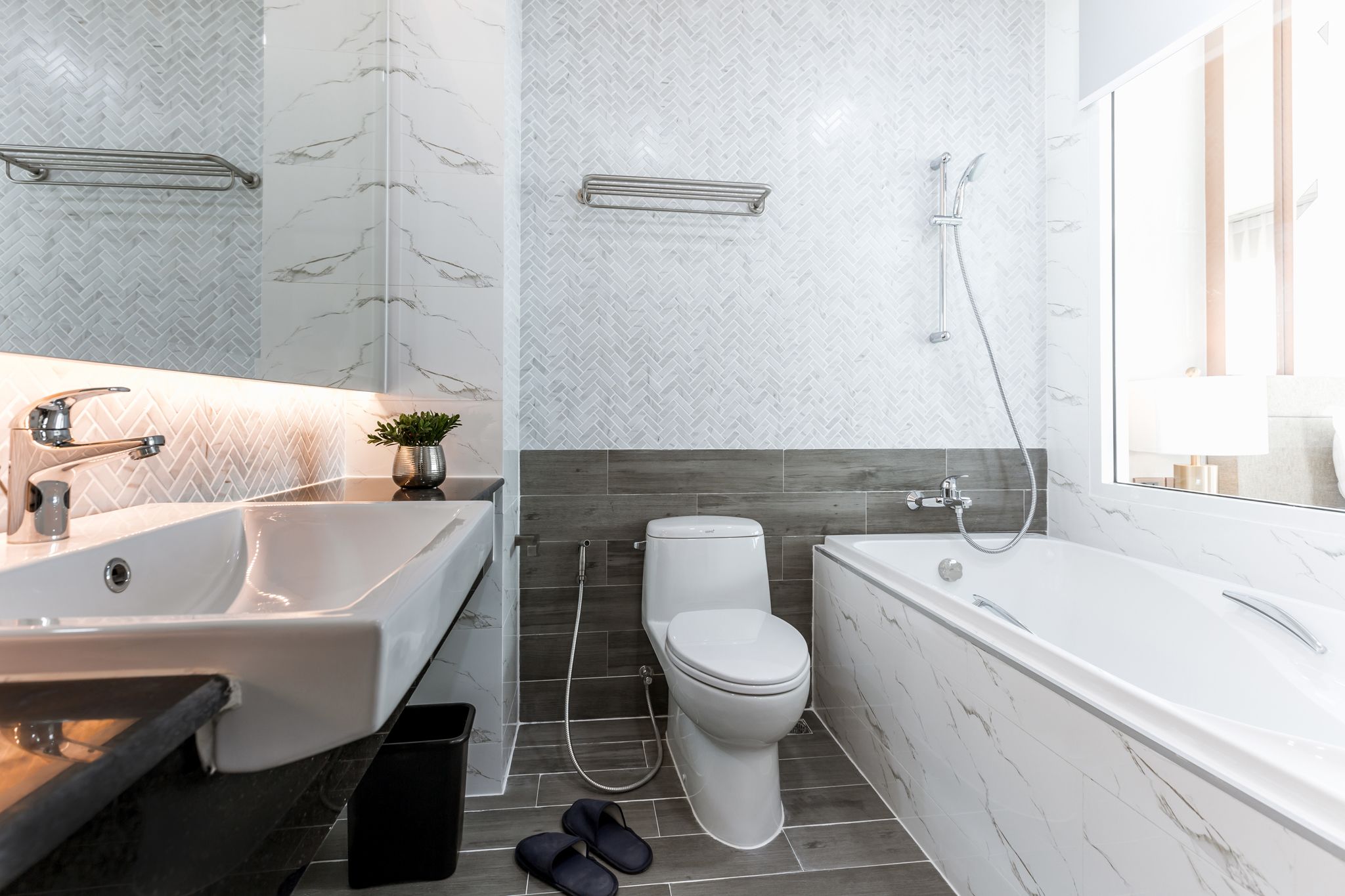 grand deluxe king with city view | bathroom | free toiletries, hair dryer, slippers, towels