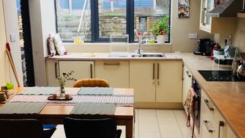 Microwave, dishwasher, coffee/tea maker, cookware/dishes/utensils