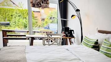 Premium Studio Suite | Living area | 52-inch flat-screen TV with satellite channels, TV, iPod dock