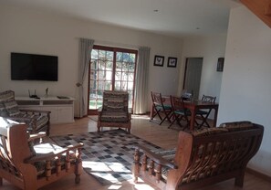 Jackal House self-catering | Living area | 32-inch Smart TV with satellite channels - Happy Jackal (Colchester)