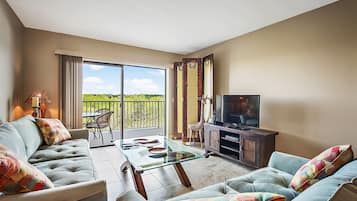 Condo, Multiple Beds, Canal View (2 Bedrooms) | Living area | 50-inch flat-screen TV with cable channels, TV, toys