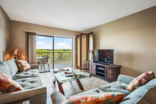 Condo, Multiple Beds, Canal View (2 Bedrooms) | Living area | 50-inch flat-screen TV with cable channels, TV, toys - Bay Shore 207 (Indian Shores)