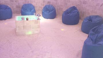 Relax in a serene seating area with plush bean bag chairs and a cozy table.