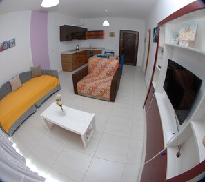 One bedroom Apartments balcony Nr.2 | Living room | Flat-screen TV - Wave Apartments Sarande (Sarandë)