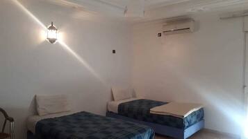 Apartment, 2 Bedrooms | Blackout curtains, rollaway beds, free WiFi, bed sheets
