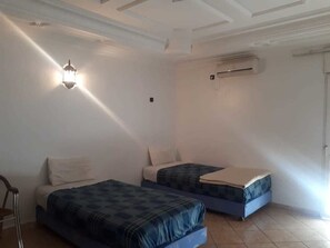 Apartment, 2 Bedrooms | Blackout curtains, rollaway beds, free WiFi, bed sheets - Residence Assaka (Ait Melloul)