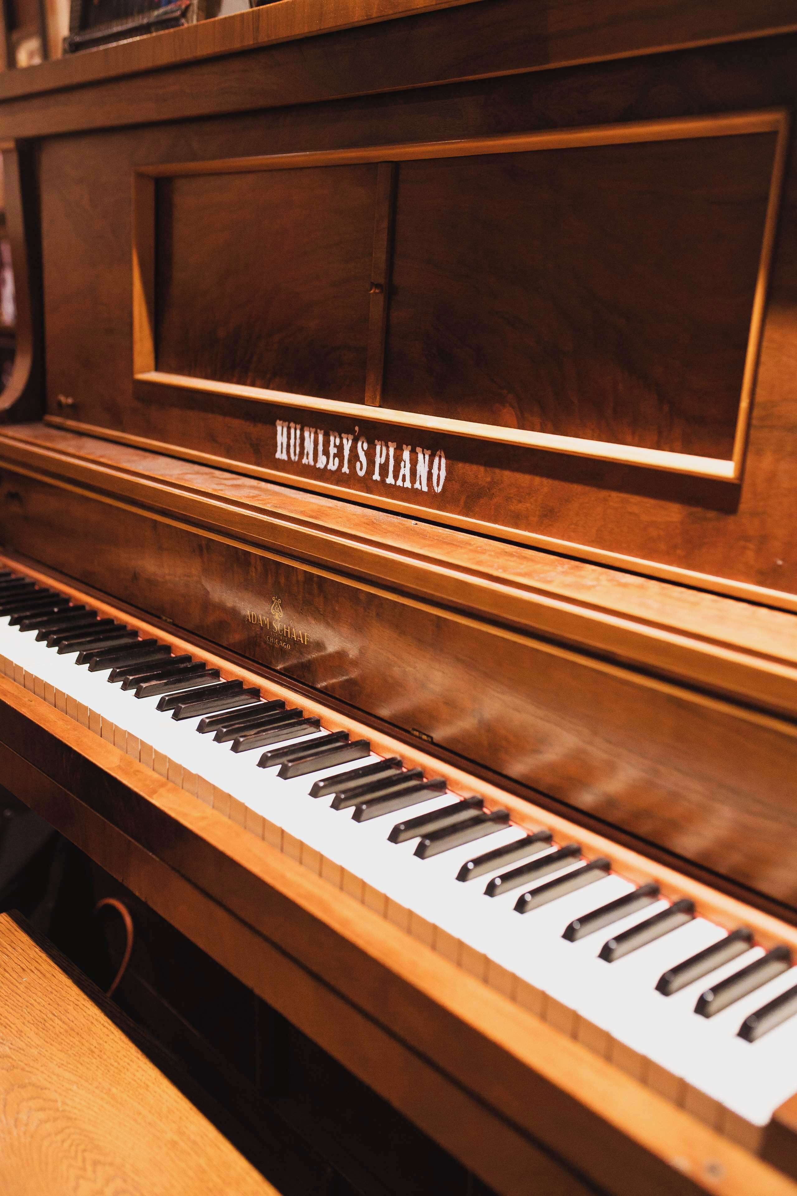A piano with the label "HUMLEY'S PIANO" on its side.