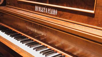 A piano with the label "HUMLEY'S PIANO" on its side.
