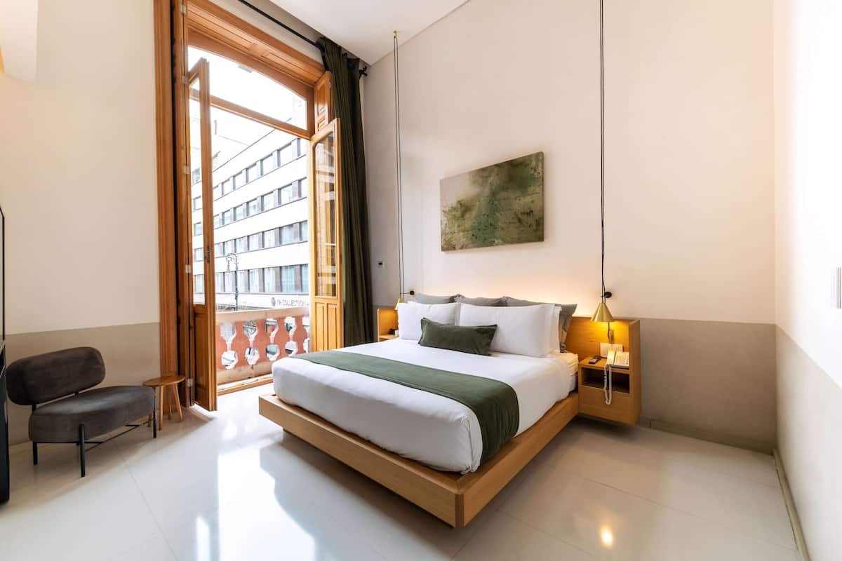 Suite, 1 Bedroom, Balcony | Down duvets, in-room safe, individually decorated, desk