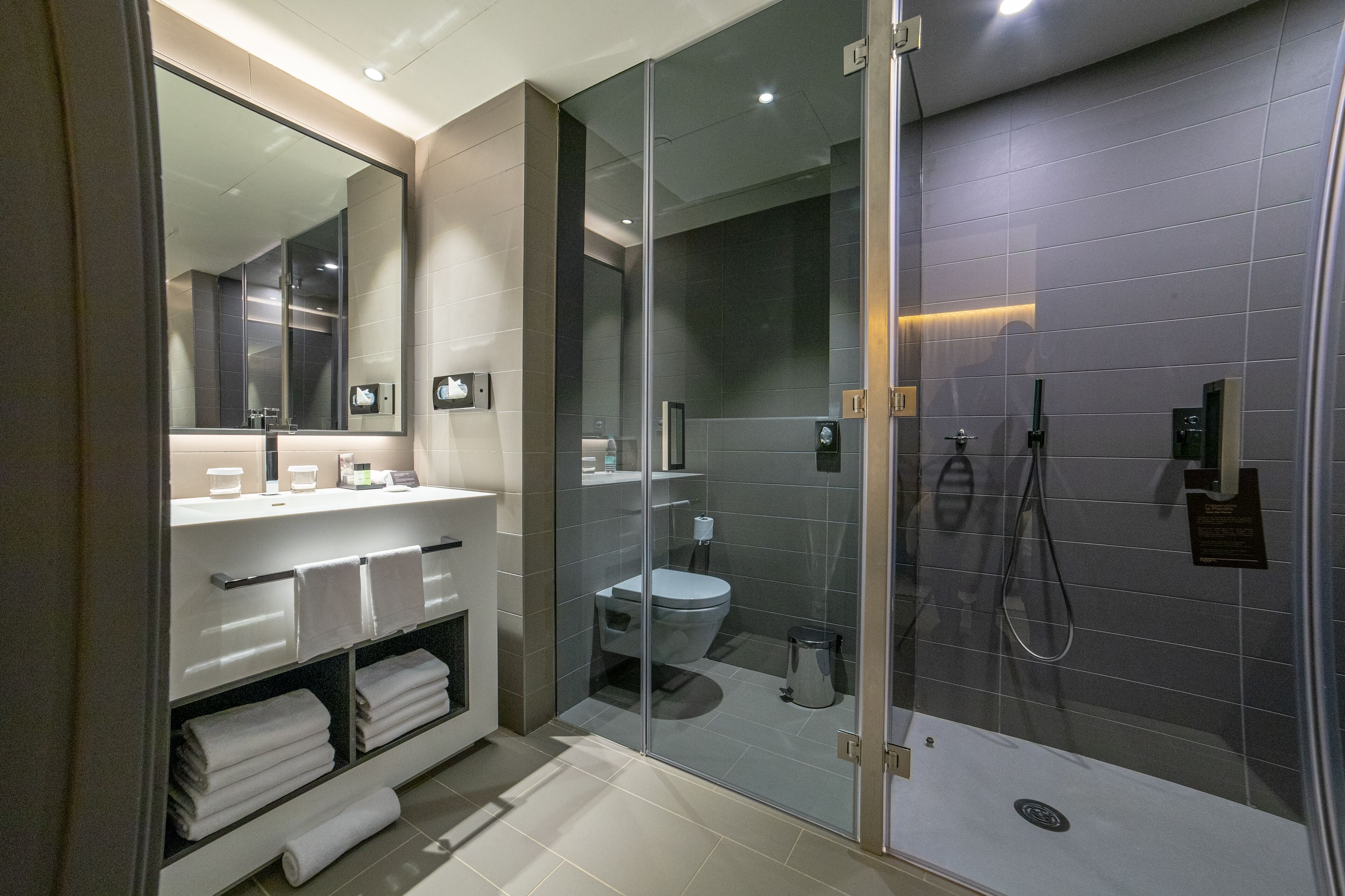 deep-soaking bathtub, rainfall showerhead, free toiletries, bathrobes