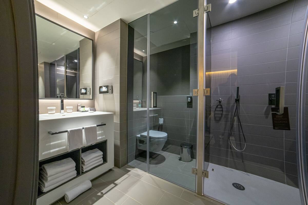 deep-soaking bathtub, rainfall showerhead, free toiletries, bathrobes