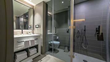 Deep-soaking bathtub, rainfall showerhead, free toiletries, bathrobes