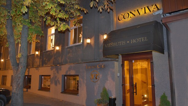A hotel entrance with a sign reading "CONVIVA HOTEL" and "Kavine Café" below. - Conviva Hotel (Panevezys)