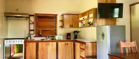 Fridge, oven, coffee/tea maker, cookware/dishes/utensils