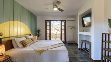 Deluxe King w/patio (Room 6) | Individually decorated, individually furnished, iron/ironing board