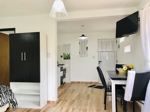 Design Loft, 1 Queen Bed, Mountain View | Living area | Flat-screen TV